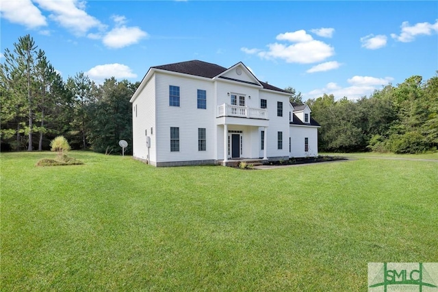 173 Trail Rd S, Midway, GA 31320 - view of front of house with a front lawn and a balcony