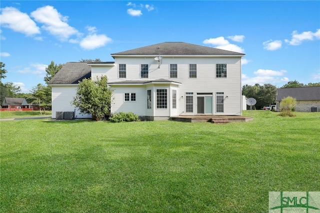 173 Trail Rd S, Midway, GA 31320 - rear view of house featuring cooling unit and a lawn