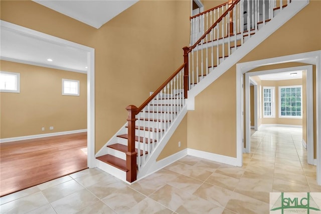173 Trail Rd S, Midway, GA 31320 - stairs with tile patterned floors, a high ceiling, baseboards, and recessed lighting