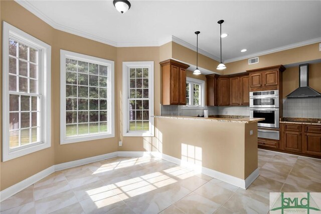 173 Trail Rd S, Midway, GA 31320 - kitchen with tasteful backsplash, a warming drawer, crown molding, wall chimney exhaust hood, and double oven