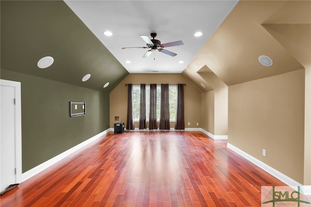 additional living space featuring lofted ceiling, ceiling fan, and hardwood / wood-style flooring