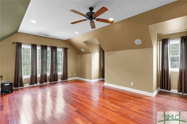 additional living space with lofted ceiling, ceiling fan, and hardwood / wood-style flooring