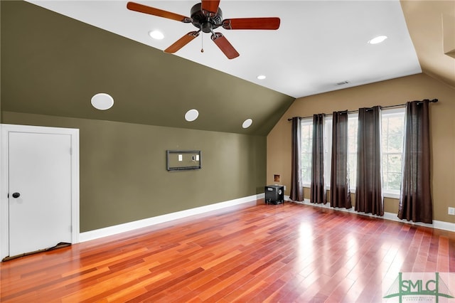 interior space featuring light hardwood / wood-style flooring, vaulted ceiling, and ceiling fan