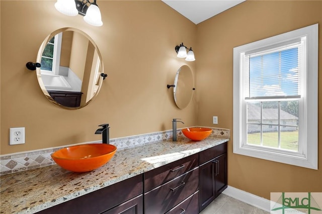 173 Trail Rd S, Midway, GA 31320 - full bathroom with a sink, baseboards, double vanity, and tile patterned flooring