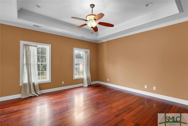 173 Trail Rd S, Midway, GA 31320 - empty room featuring visible vents, wood finished floors, and a raised ceiling