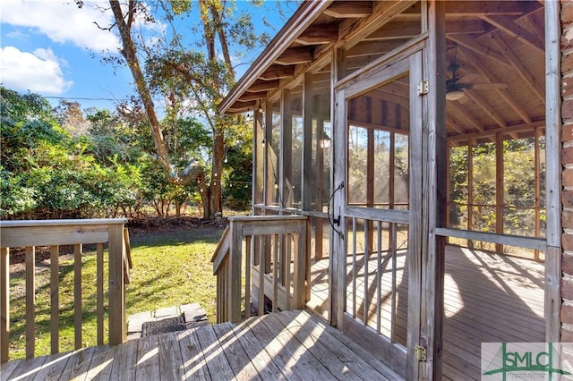 wooden terrace featuring a sunroom