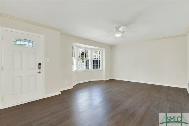 foyer with crown molding, dark hardwood / wood-style floors, and ceiling fan