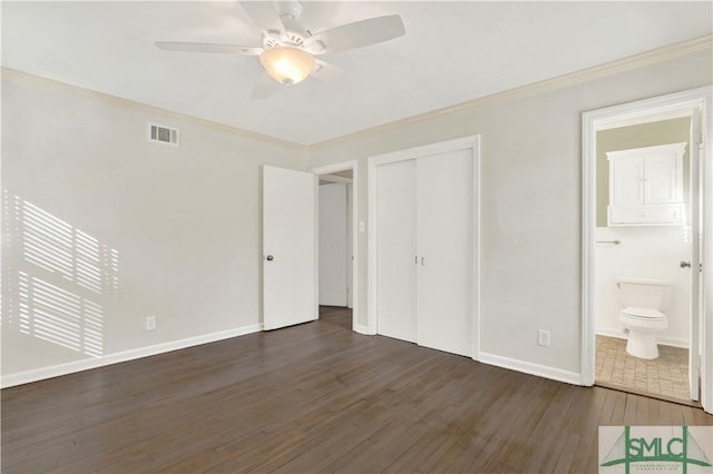 unfurnished bedroom featuring ornamental molding, visible vents, baseboards, and wood finished floors