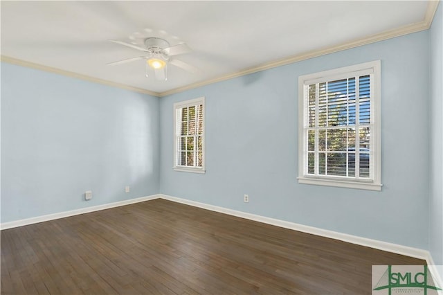 empty room with a ceiling fan, baseboards, ornamental molding, and dark wood-type flooring