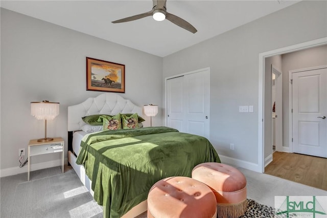 bedroom with carpet, ceiling fan, and a closet