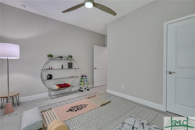 interior space featuring ceiling fan and light carpet