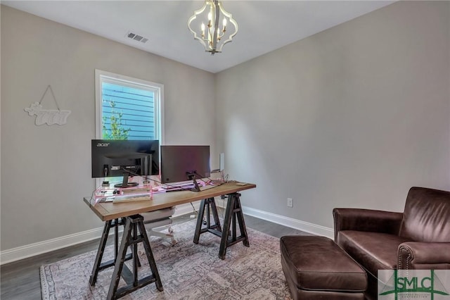 office area with wood-type flooring and a chandelier