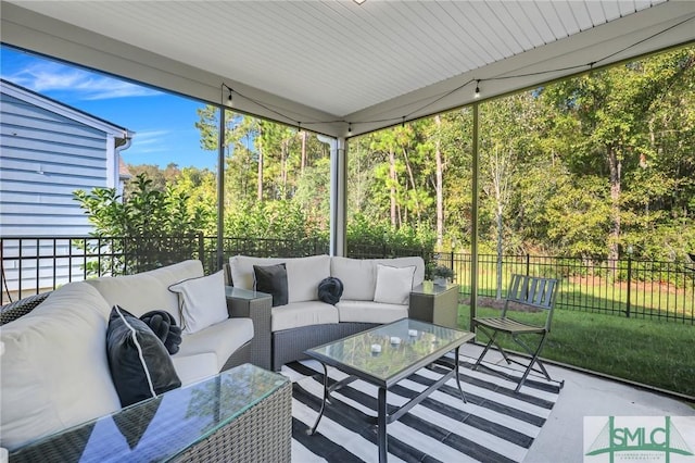 sunroom / solarium featuring a healthy amount of sunlight