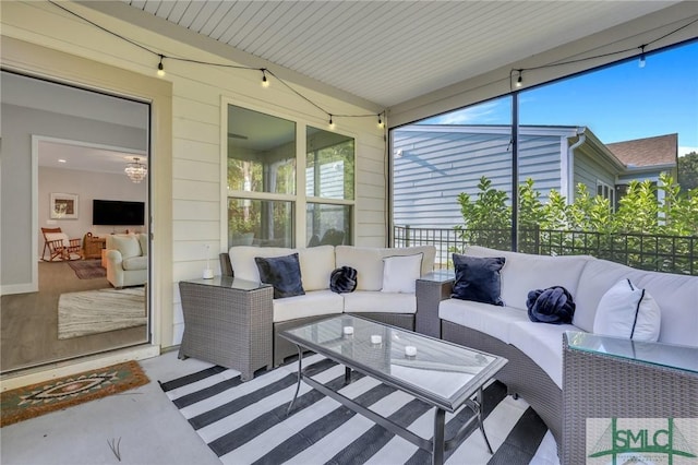 sunroom featuring lofted ceiling