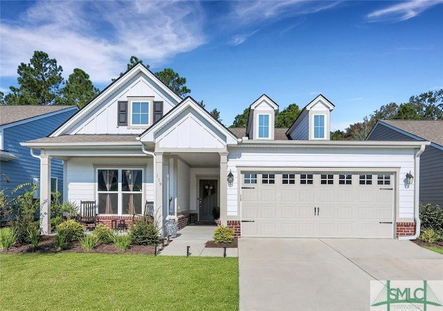 view of front of property with a garage and a front yard