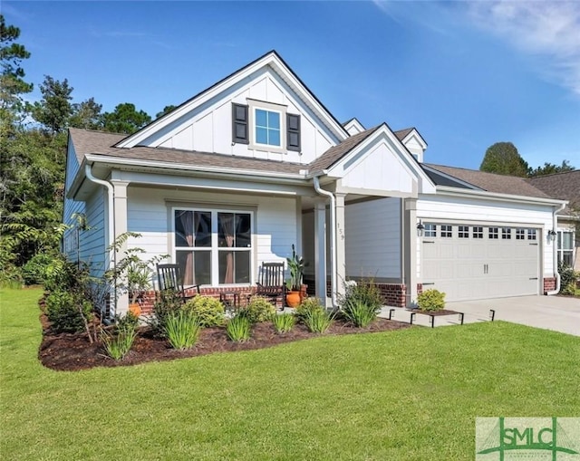 craftsman-style house featuring a garage, a porch, and a front yard