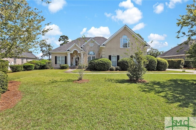 view of property with a front lawn