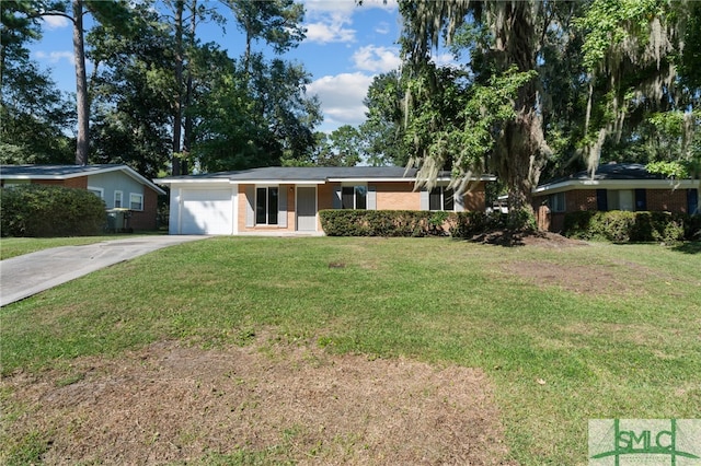 ranch-style home with a front yard and a garage