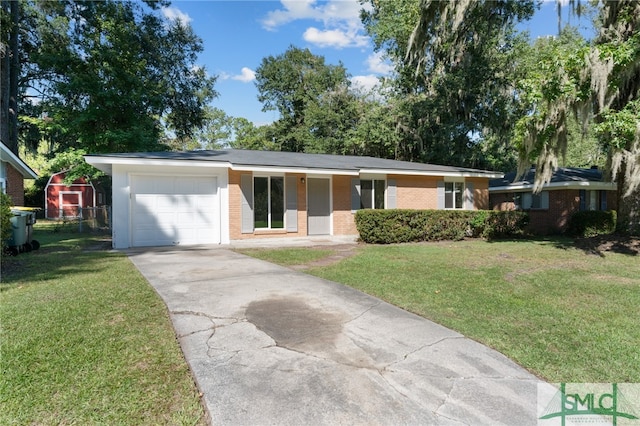 ranch-style home with a front yard and a garage