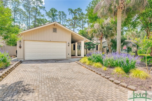 single story home with a garage