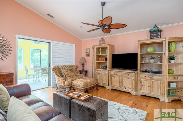 living room with ceiling fan, light wood-type flooring, crown molding, and vaulted ceiling