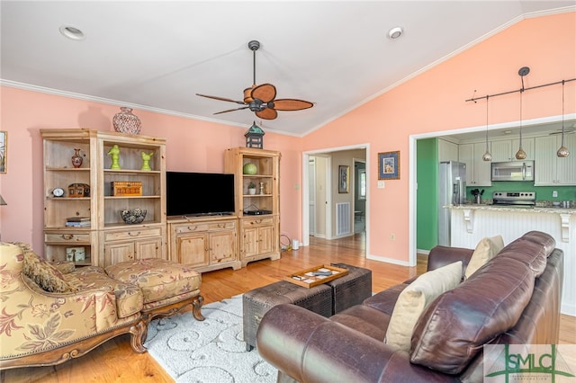 living room with light hardwood / wood-style flooring, lofted ceiling, ceiling fan, and crown molding