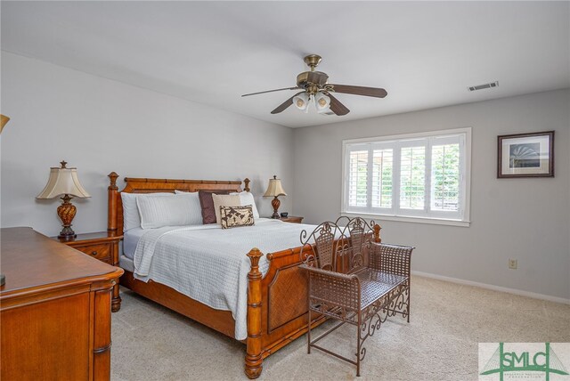 bedroom featuring light carpet and ceiling fan