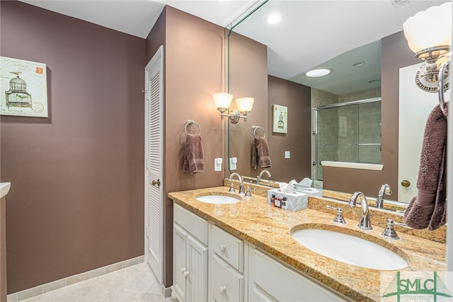 bathroom featuring tile patterned flooring, vanity, and an enclosed shower