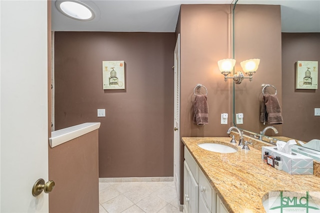 bathroom with tile patterned flooring and vanity