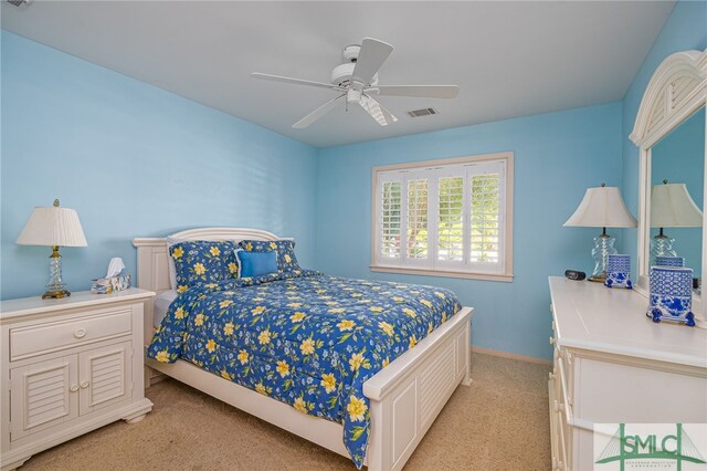 bedroom with ceiling fan and light colored carpet