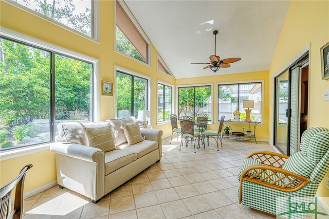 sunroom featuring vaulted ceiling and ceiling fan