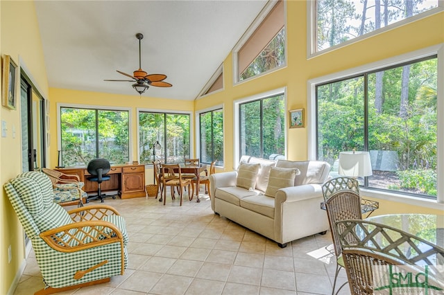 sunroom with ceiling fan and vaulted ceiling