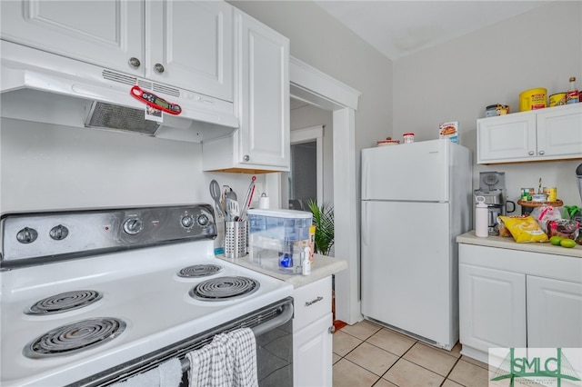 kitchen with white cabinets, white appliances, and light tile patterned floors