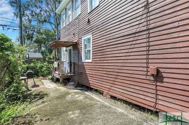 view of side of home with a patio