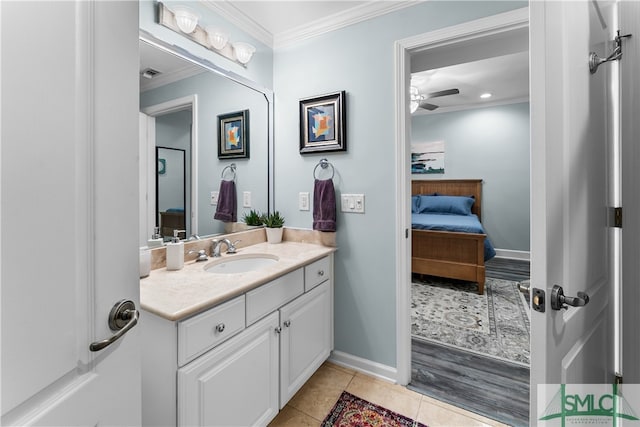 bathroom with crown molding, tile patterned flooring, vanity, and ceiling fan