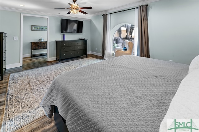 bedroom with ornamental molding, ceiling fan, and hardwood / wood-style flooring