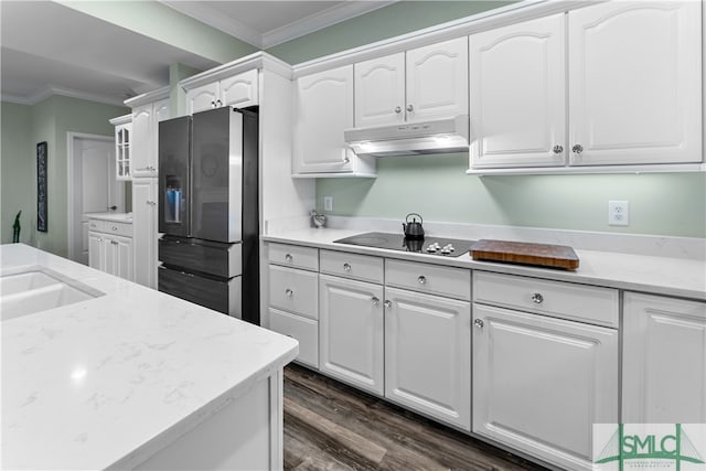 kitchen with dark hardwood / wood-style flooring, white cabinetry, crown molding, and stainless steel fridge