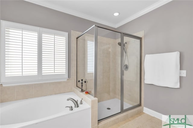 bathroom featuring tile patterned floors, ornamental molding, and separate shower and tub