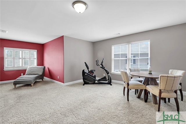 view of carpeted dining space