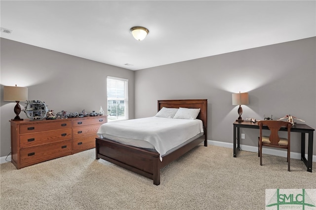 bedroom with light carpet