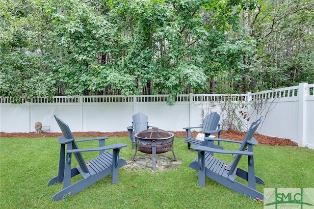 view of yard with an outdoor fire pit