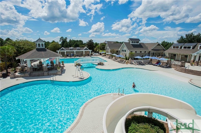 view of swimming pool with a gazebo and a patio area