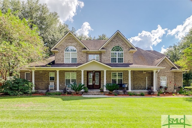 view of front of home with a front lawn and covered porch