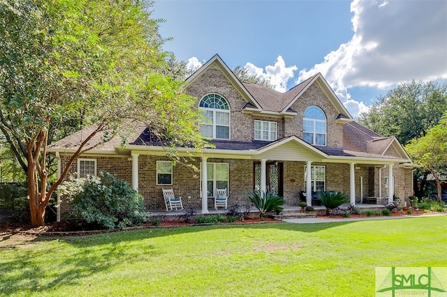 view of front of house featuring a front lawn and a porch