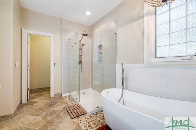 bathroom featuring plus walk in shower