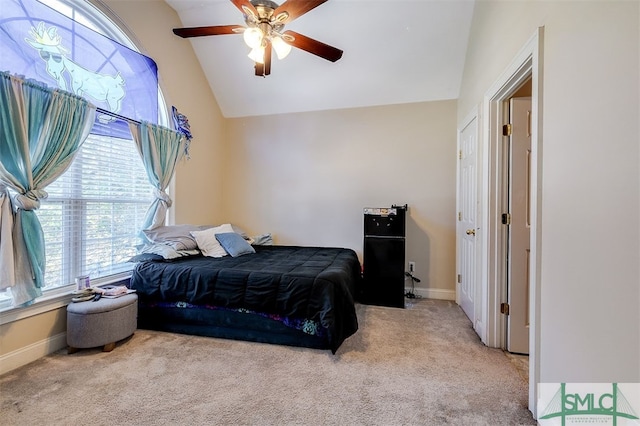 carpeted bedroom featuring vaulted ceiling and ceiling fan