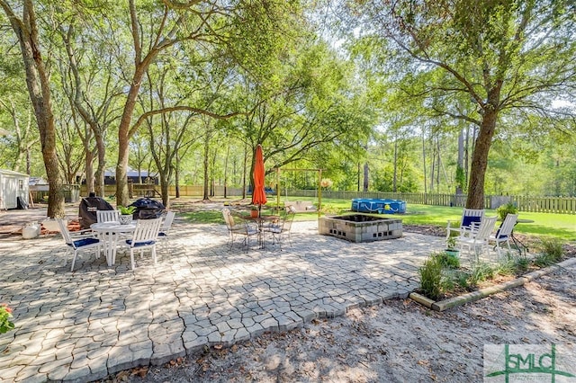 view of patio / terrace with a fire pit