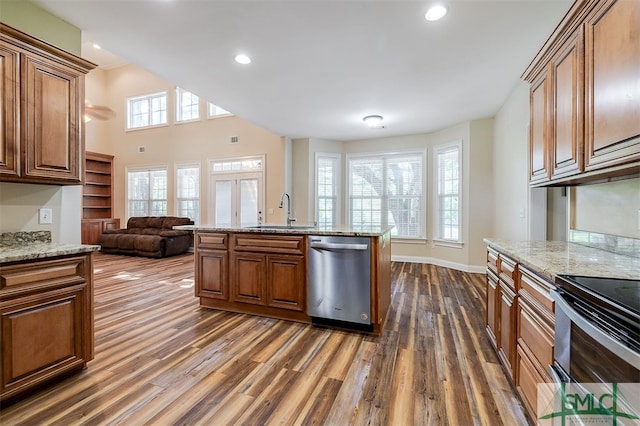 kitchen featuring dishwasher, dark hardwood / wood-style floors, sink, and a healthy amount of sunlight