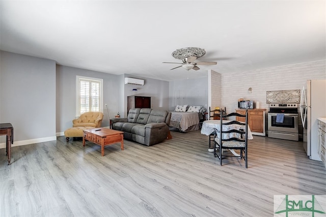 living room with ceiling fan, light wood-type flooring, and an AC wall unit