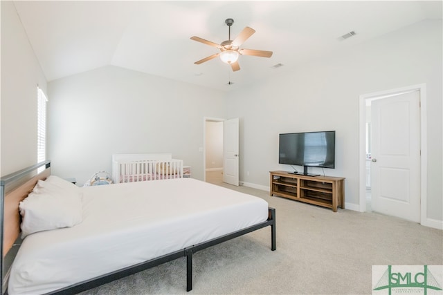 carpeted bedroom with vaulted ceiling and ceiling fan